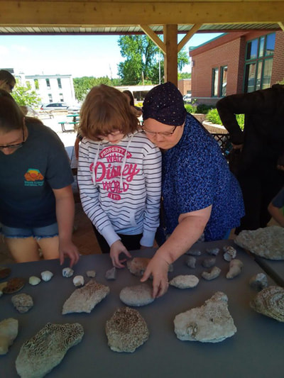 mother & child explore fossils together