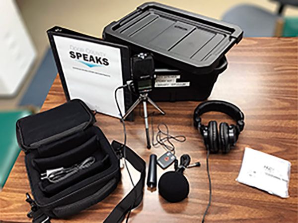 audio recorder, haedphones, tripod, carrying case & manual