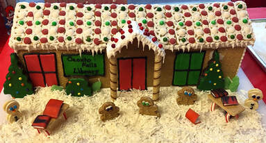 Gingerbread library with cookie characters and books