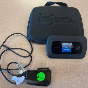 Photo of the Kajeet SmartSpot wifi hotspot with carrying case and power cord.