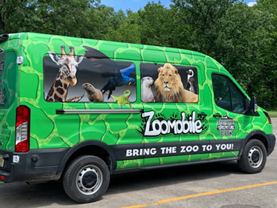 The Zoomobile is wrapped in green 